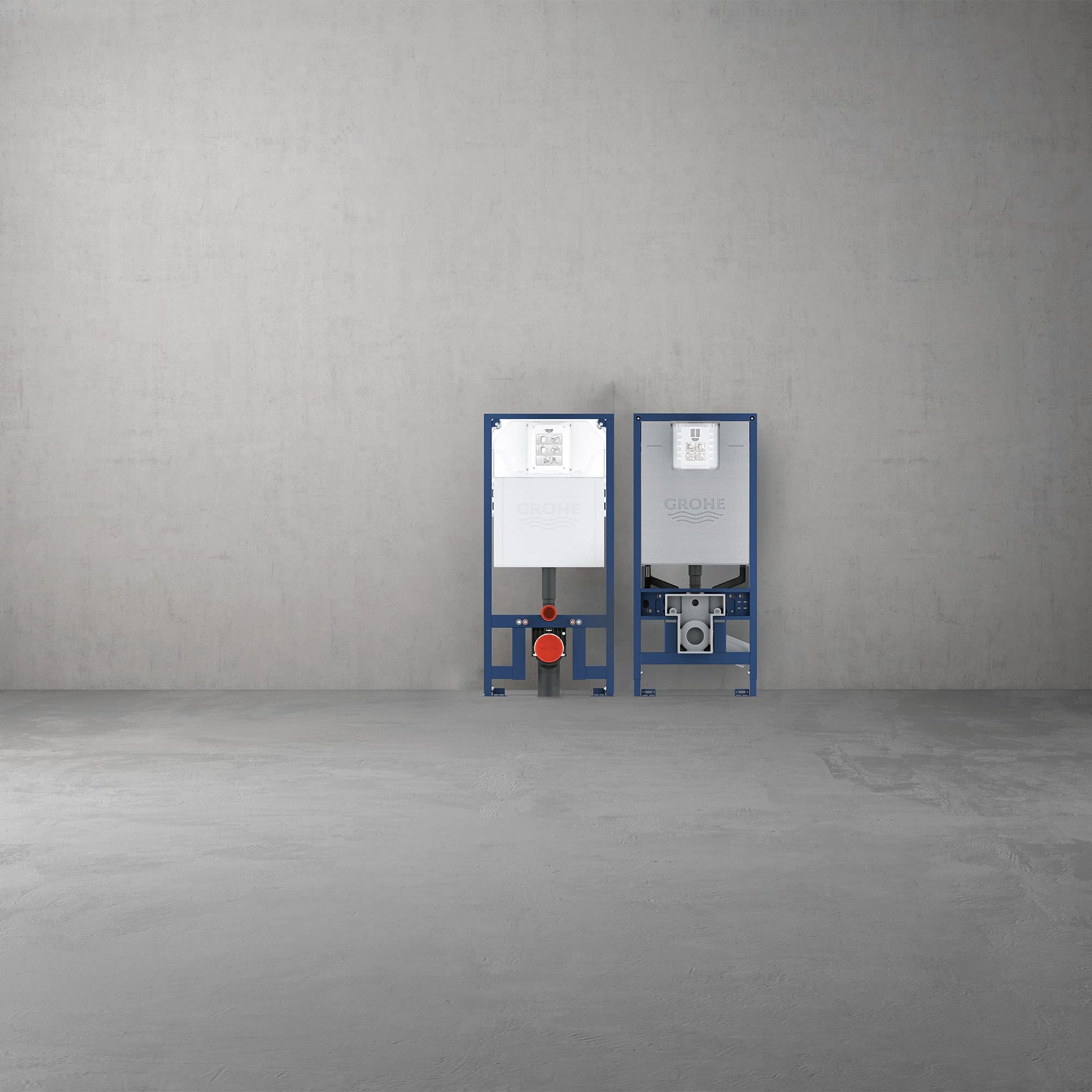 Two blue metal in-wall toilet carriers with white cistern covers and red valve handles mounted on concrete wall.