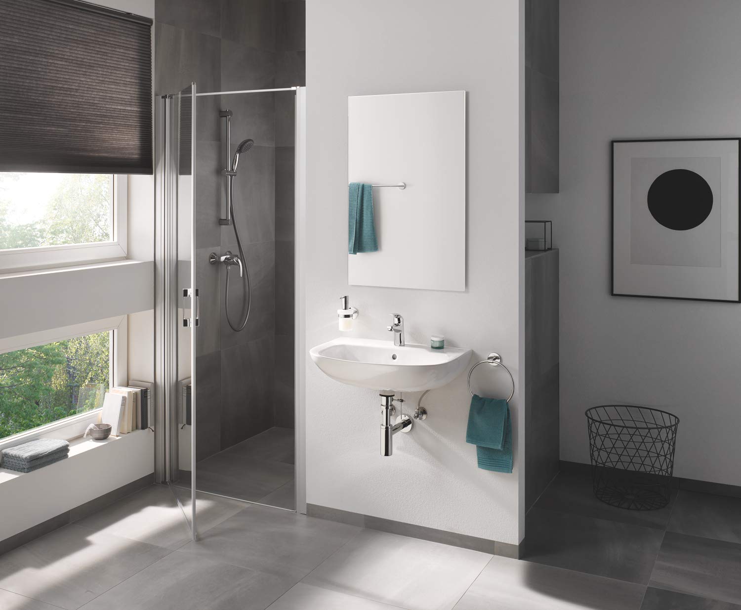 Chrome towel bar mounted horizontally on white bathroom wall above sink.