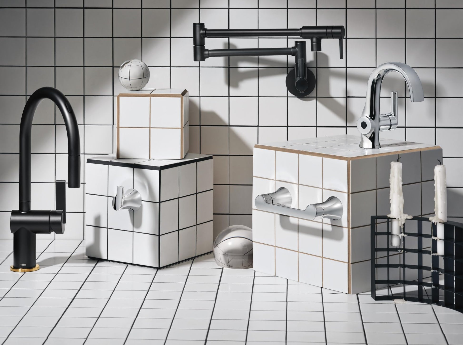 Matte black wall-mounted pot filler faucet with double-jointed swing arm and folding design above kitchen counter.