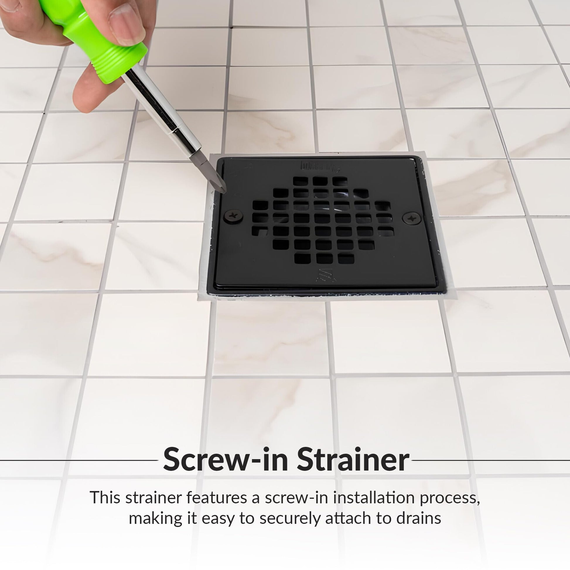 Matte black square shower strainer with grid pattern holes and two screw holes, shown on tile with screwdriver.