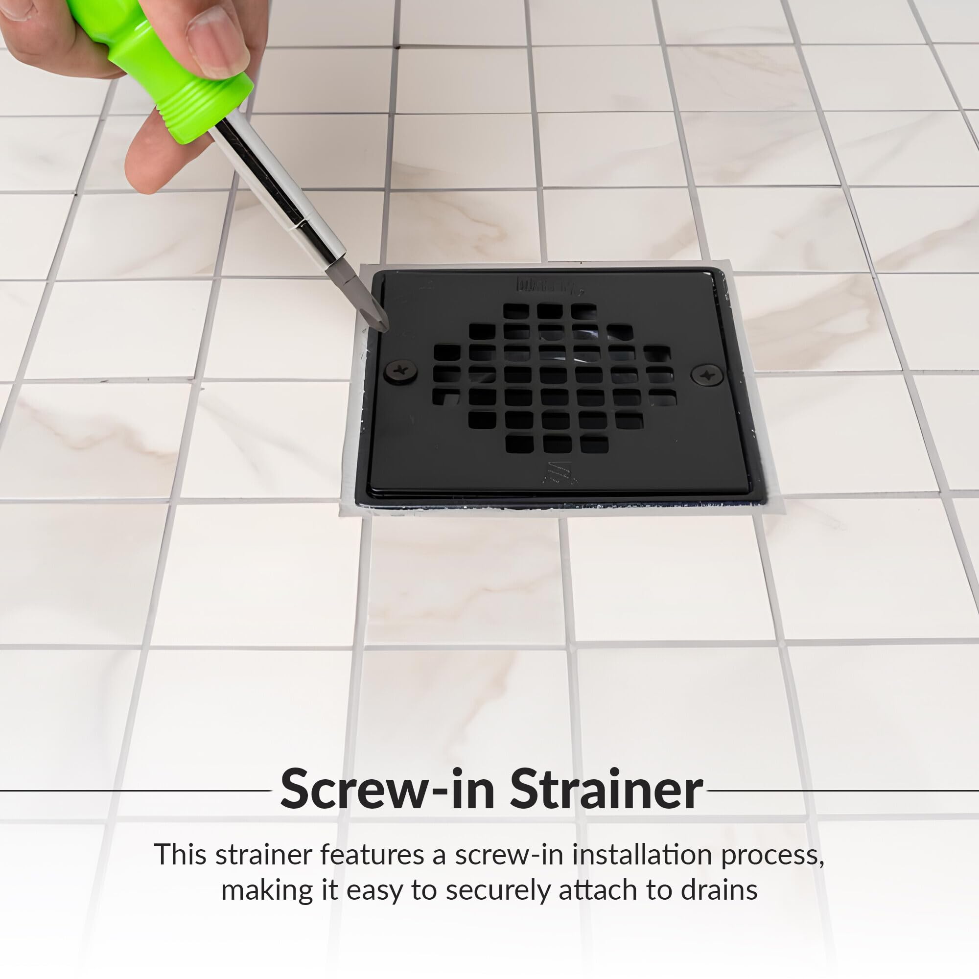 Matte black square shower strainer with grid pattern holes and two screw holes, shown on tile with screwdriver.