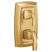 Brushed gold shower trim with upper diverter lever and lower volume control handle mounted on rectangular escutcheon plate.