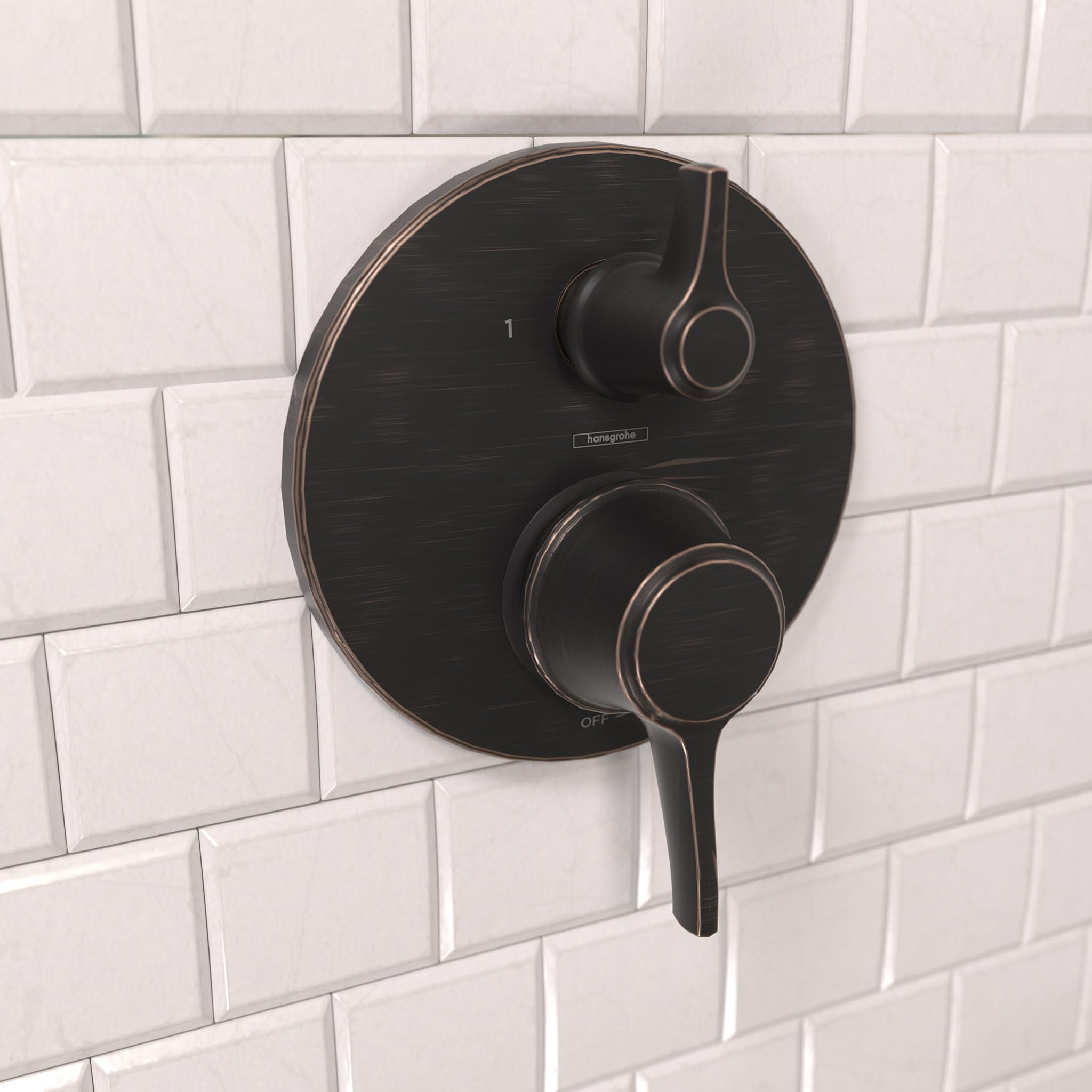 Round rubbed bronze shower valve trim with pressure balance control and diverter handle mounted on white subway tile.