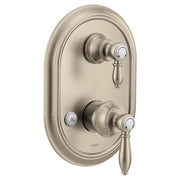 Brushed nickel shower trim with two lever handles and integrated transfer valve on oval escutcheon plate.