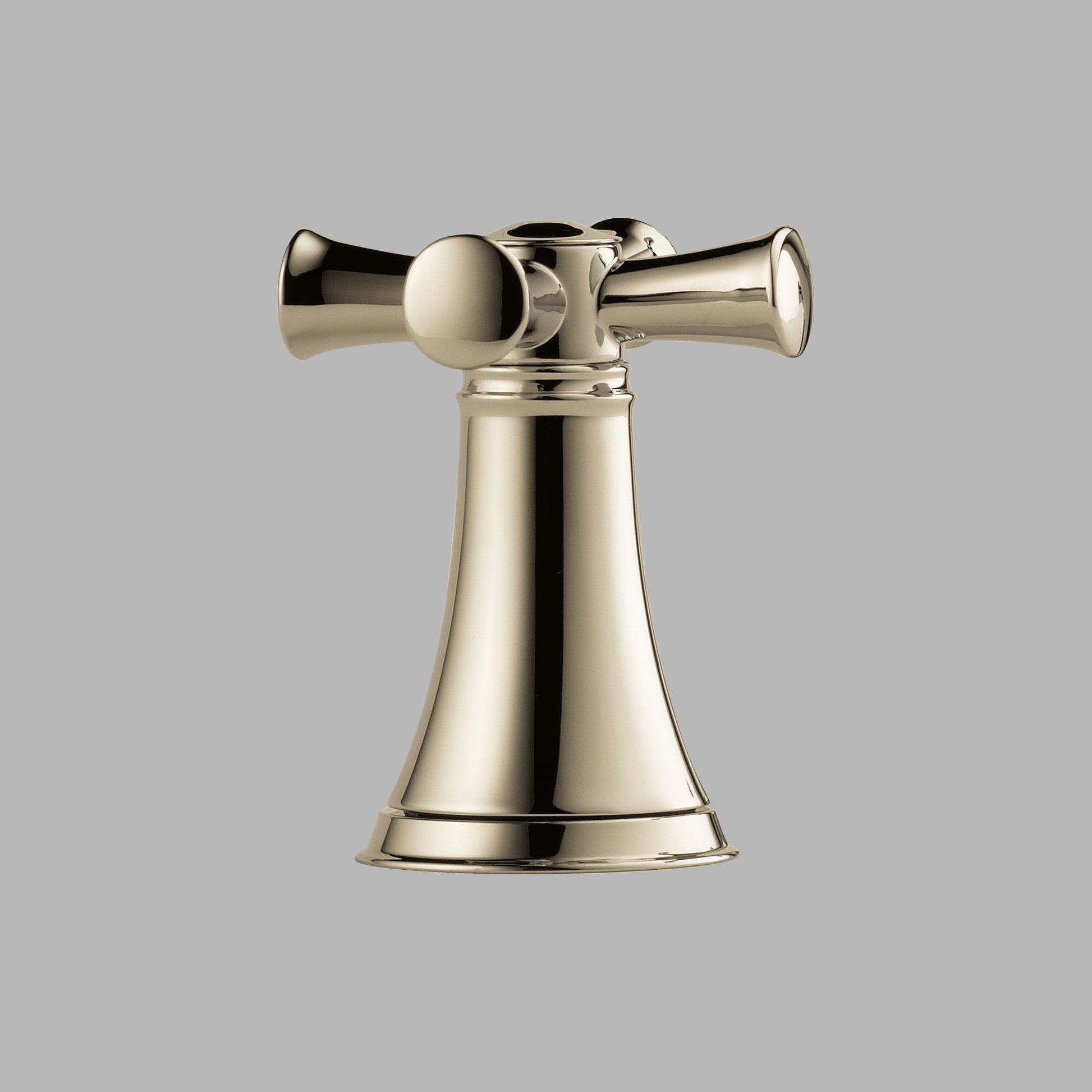 Polished nickel faucet with cross handles mounted on conical base with bell-shaped body.