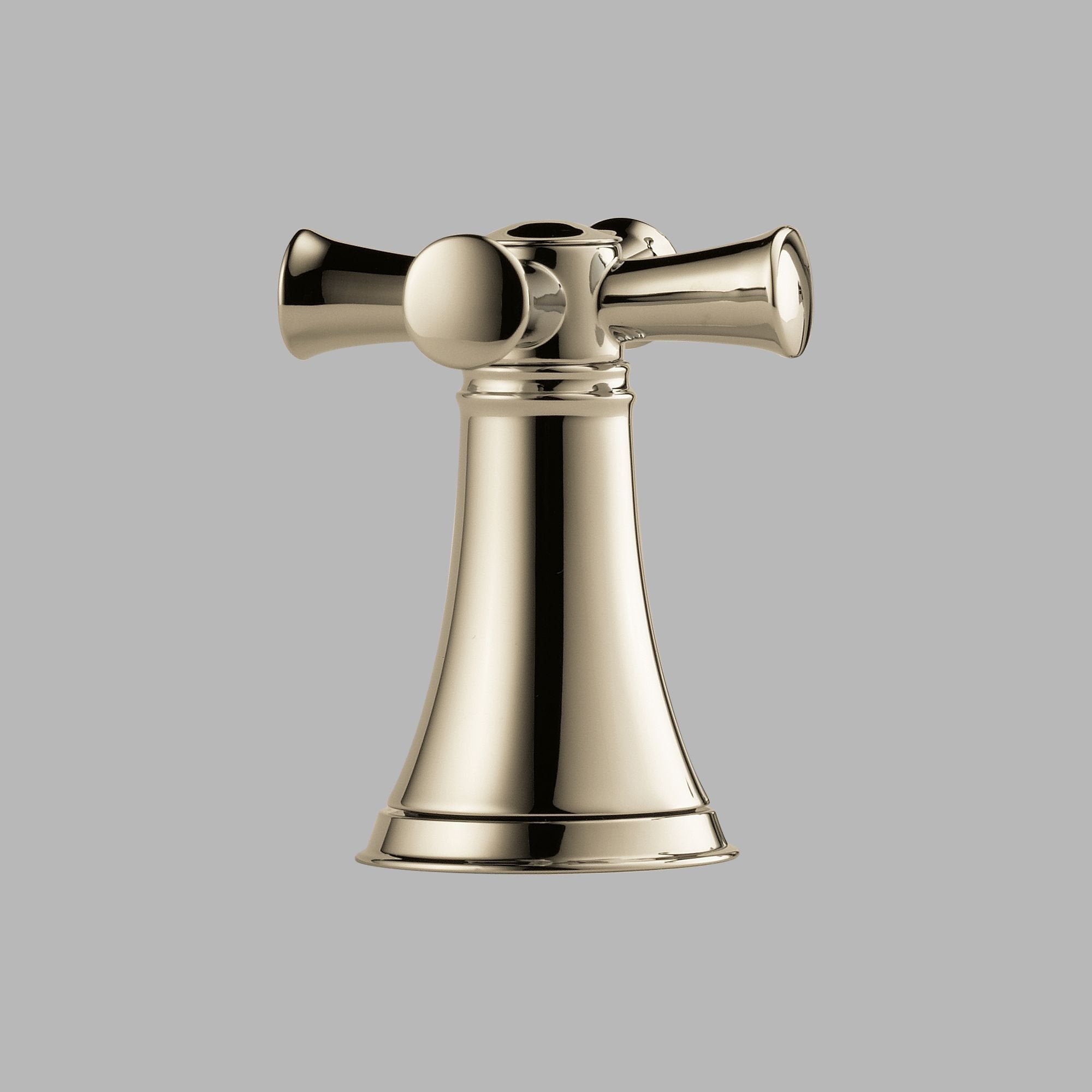 Polished nickel faucet with cross handles mounted on conical base with bell-shaped body.