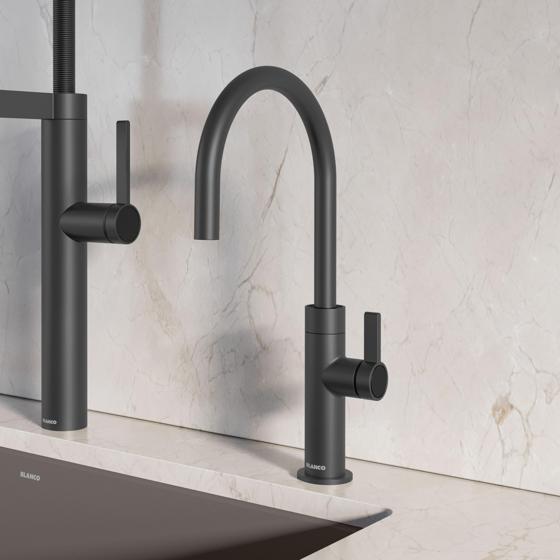 Matte black beverage faucet with curved spout and side lever handle installed on marble countertop.