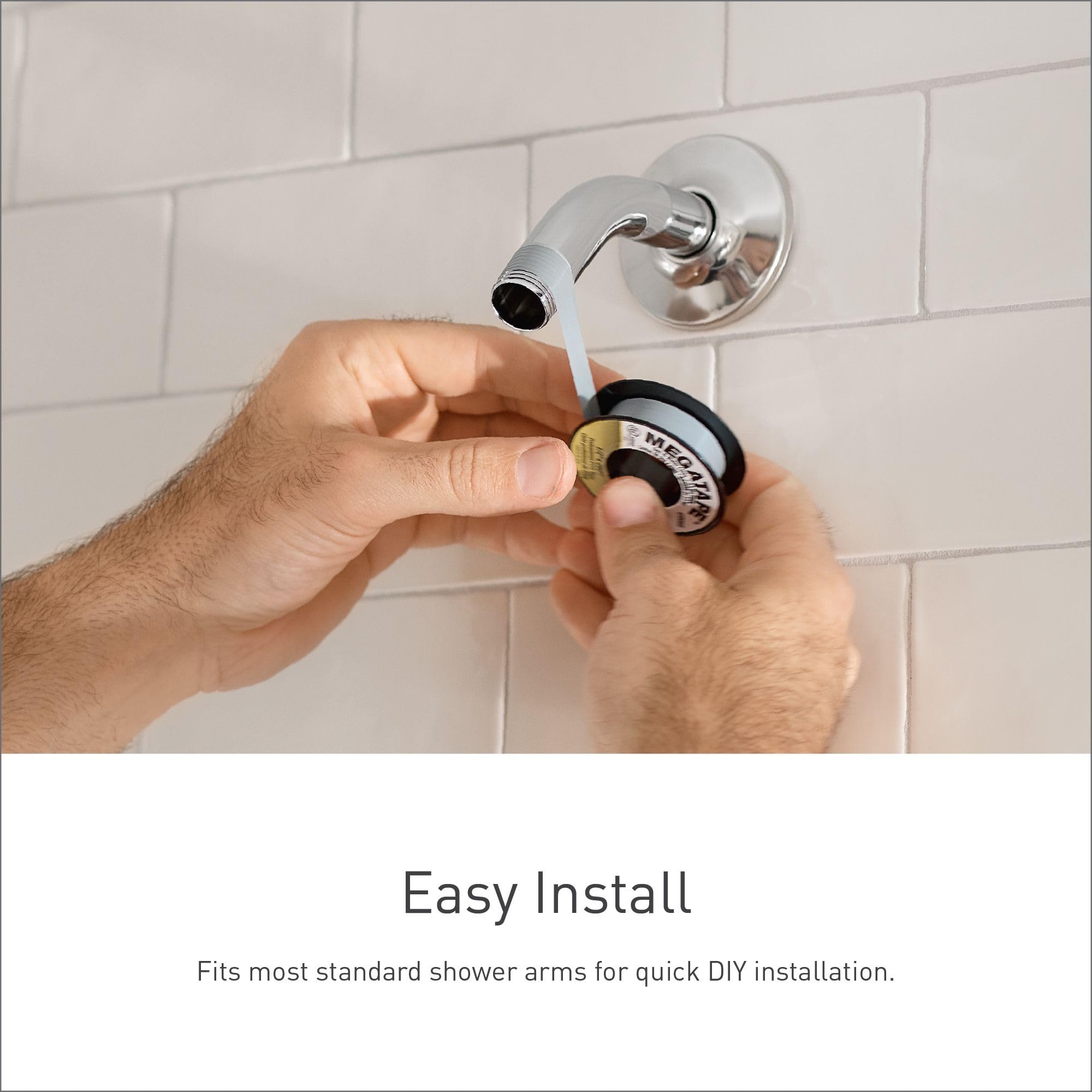 Polished nickel rainshowerhead with adjustable dial being installed onto white subway tile shower wall.