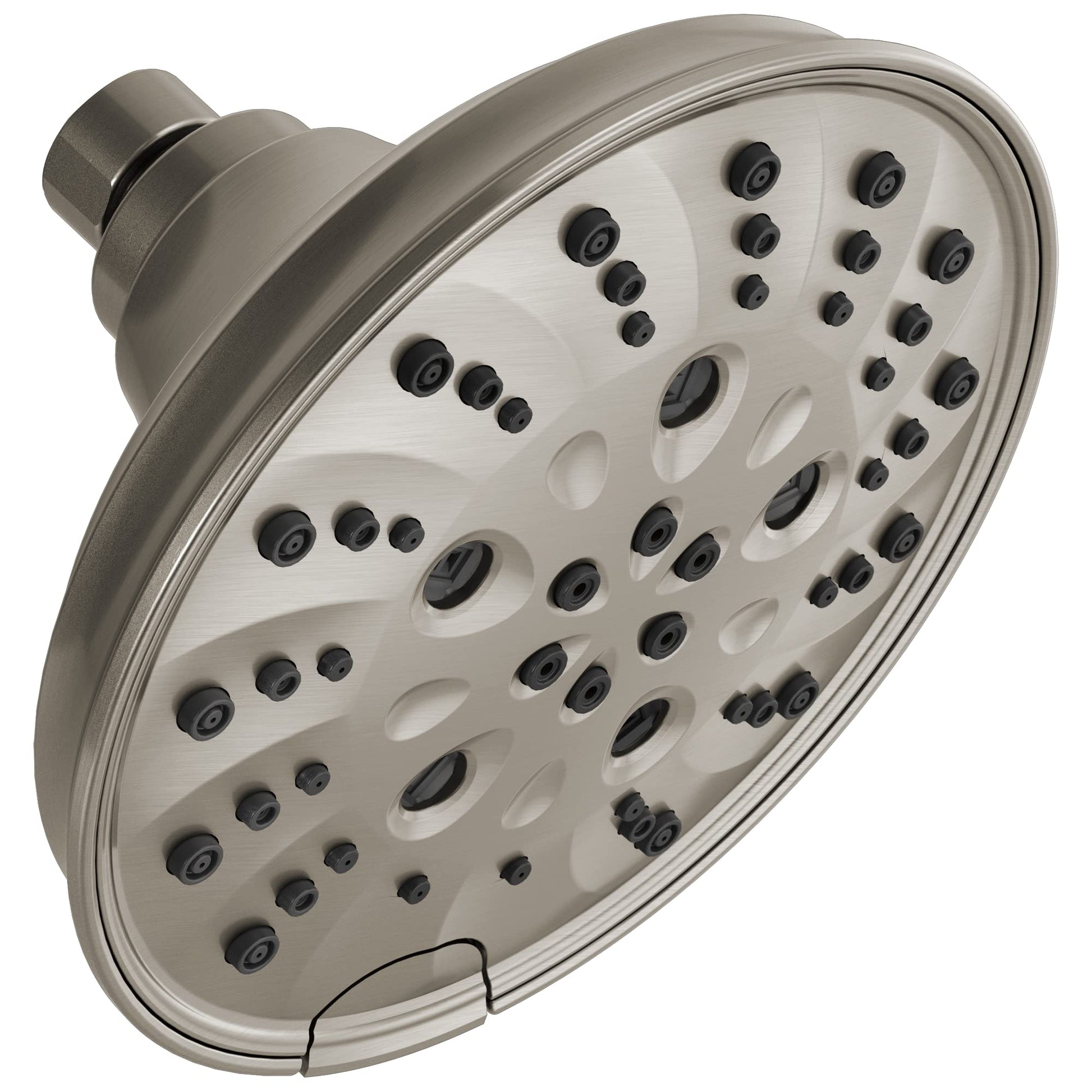 Round brushed nickel shower head with multiple spray jets arranged across cream-colored face plate and cylindrical arm.