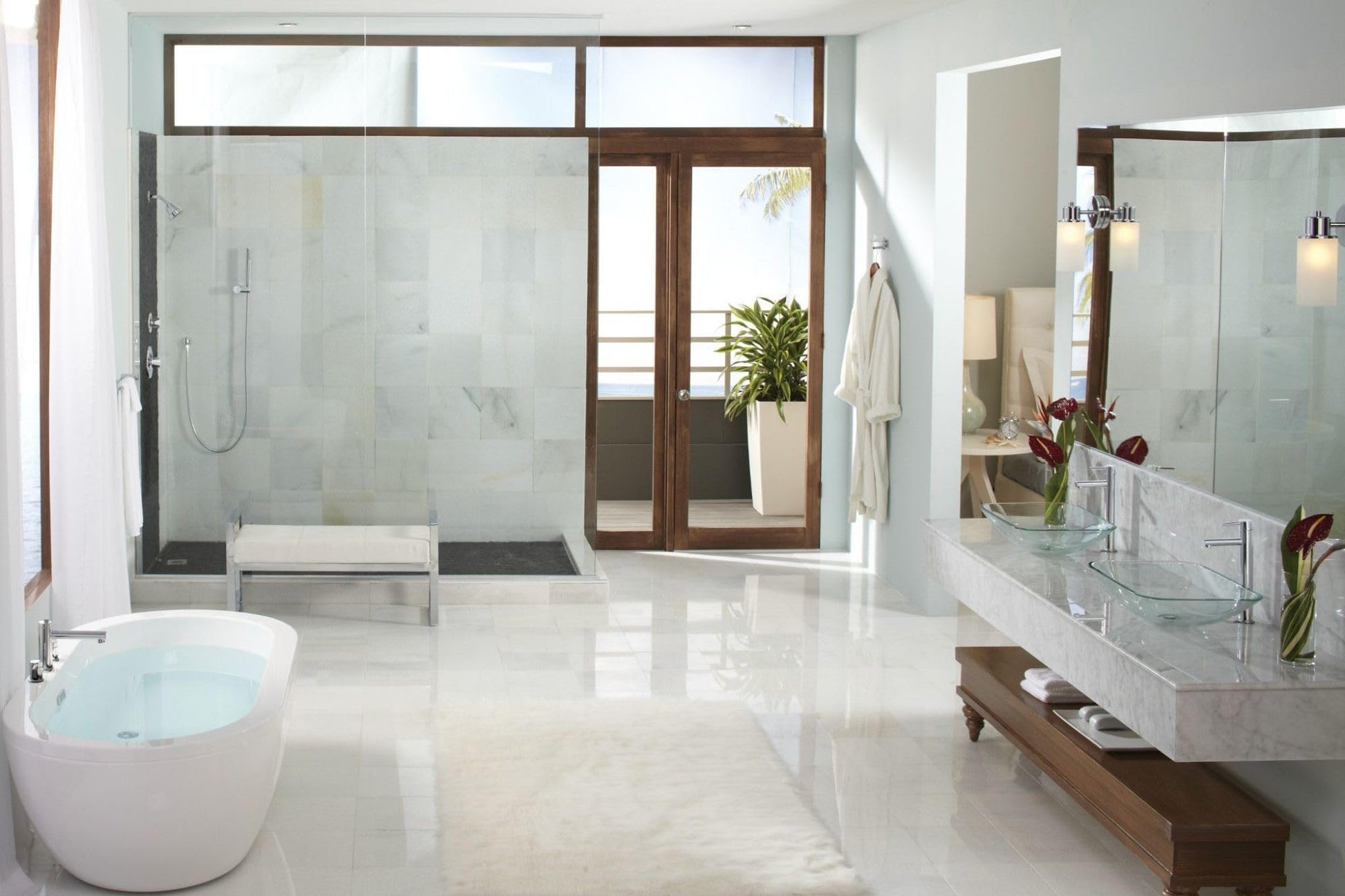 Chrome two-handle deck mount roman tub faucet trim kit with single function handshower displayed in modern bathroom setting.