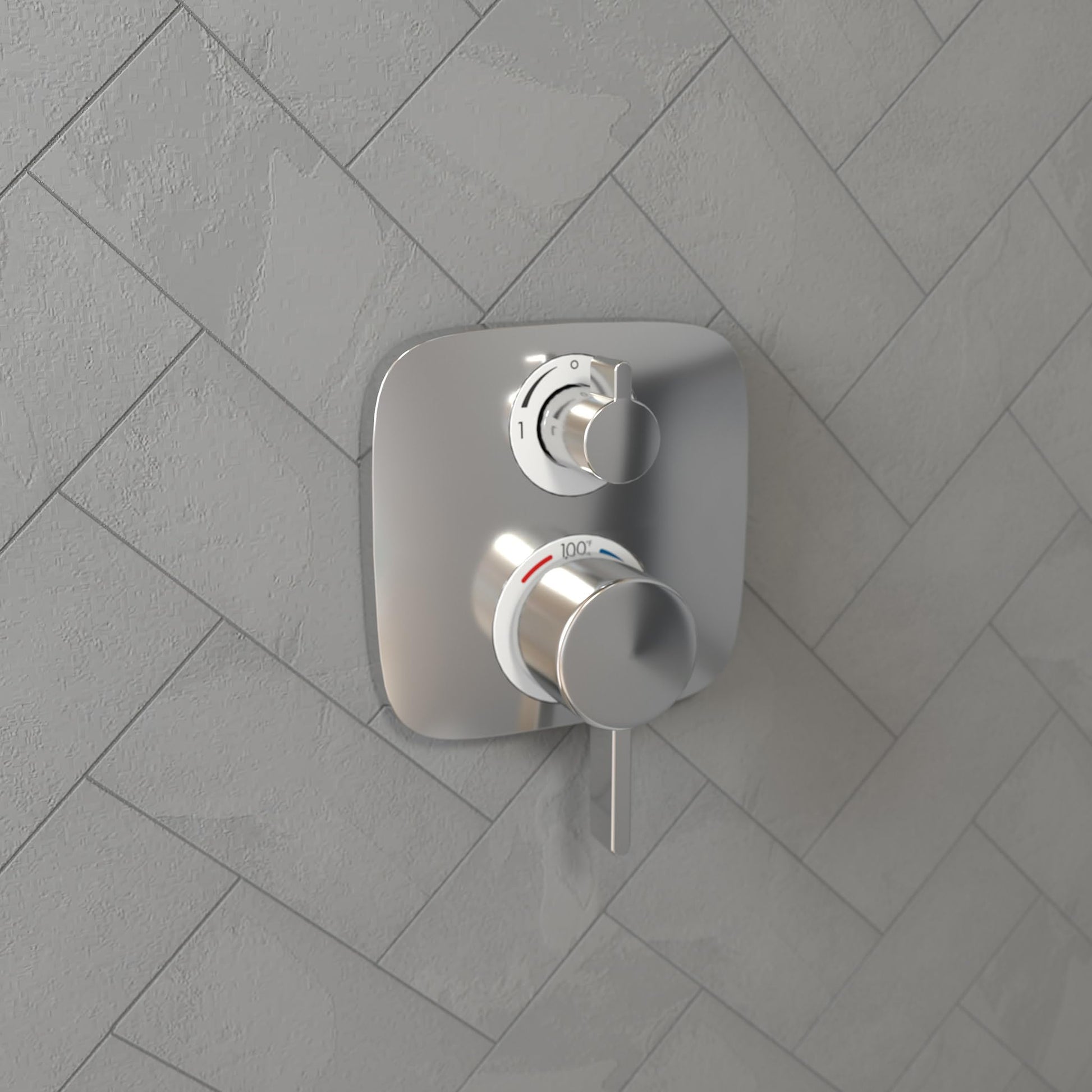 Chrome thermostatic shower trim with two circular control knobs mounted on rectangular plate against herringbone tile wall.