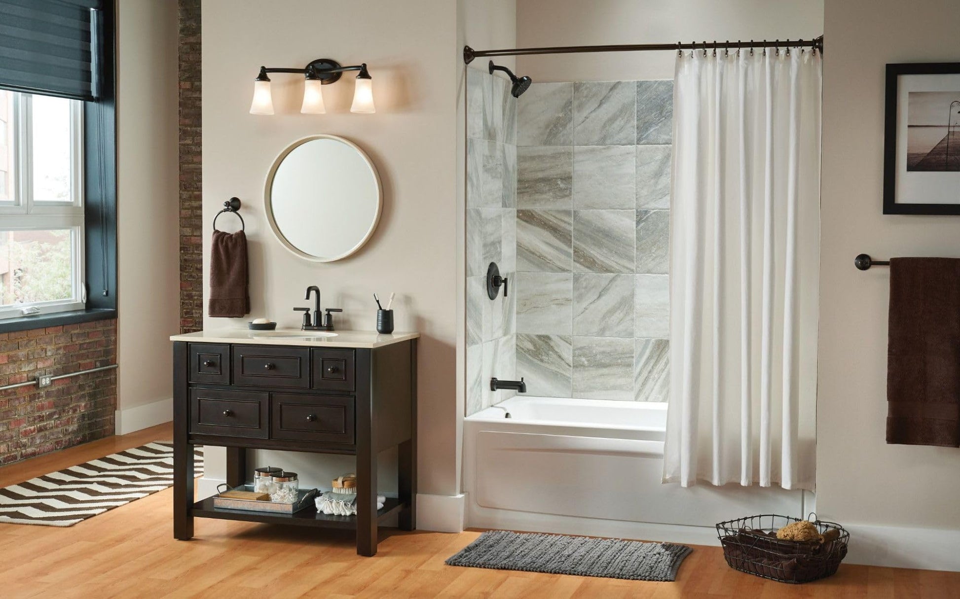 Oil-rubbed bronze vanity light fixture with three frosted glass shades mounted above bathroom sink.