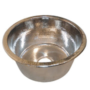 Polished nickel round bar sink with hammered interior texture and decorative beaded rim.