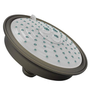 Round shower head with English bronze finish, white face with teal spray jets, and adjustment dial.