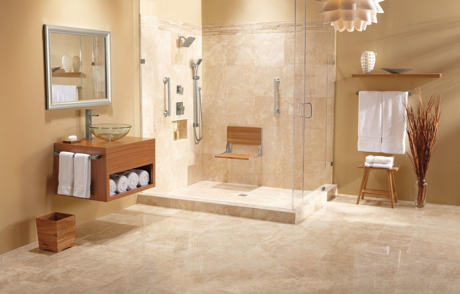 Brushed nickel shower trim system with handheld and fixed showerheads installed in tiled bathroom enclosure.
