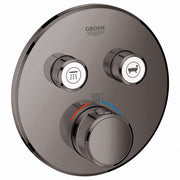 Grohe Grohtherm thermostatic valve trim in hard graphite with two function selectors and temperature control dial.