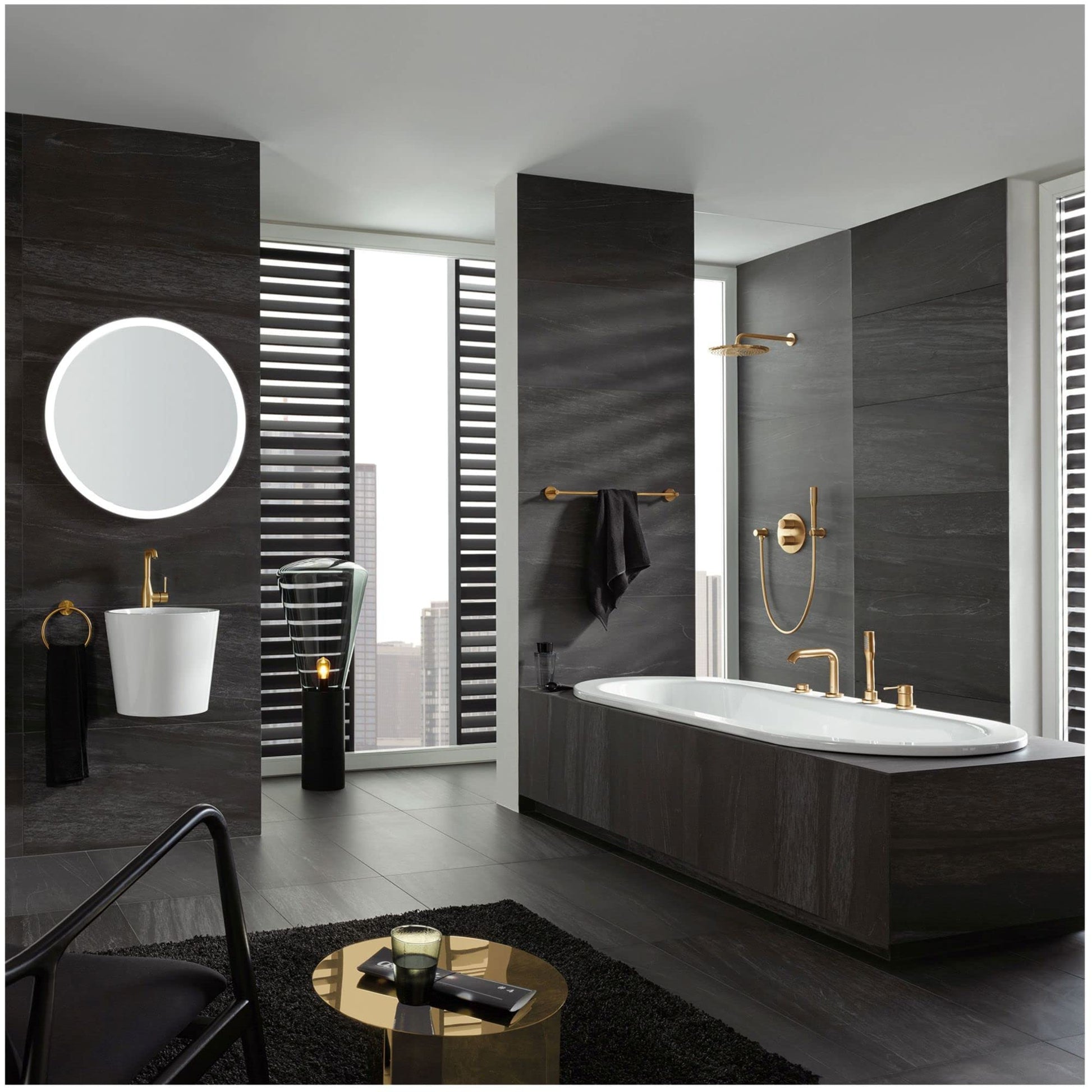 Dark graphite single-handle deck mount roman tub faucet with hand shower in modern bathroom setting.