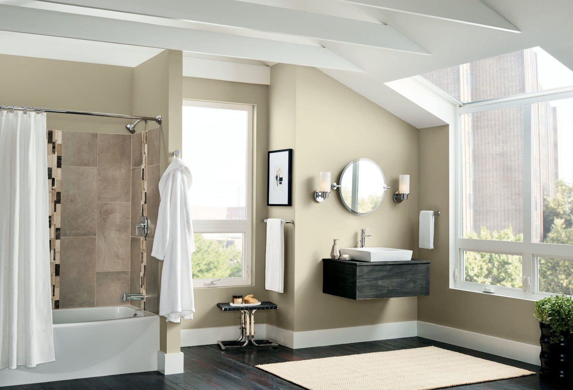 Chrome wall-mounted robe hook displayed above bathroom vanity.