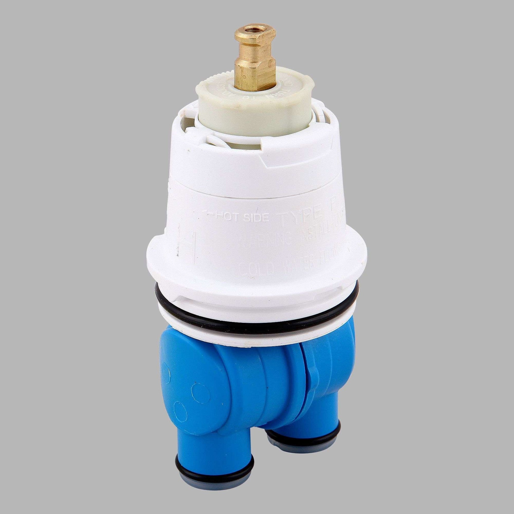 Brass and white cartridge assembly with blue plastic valve body and black seal ring.