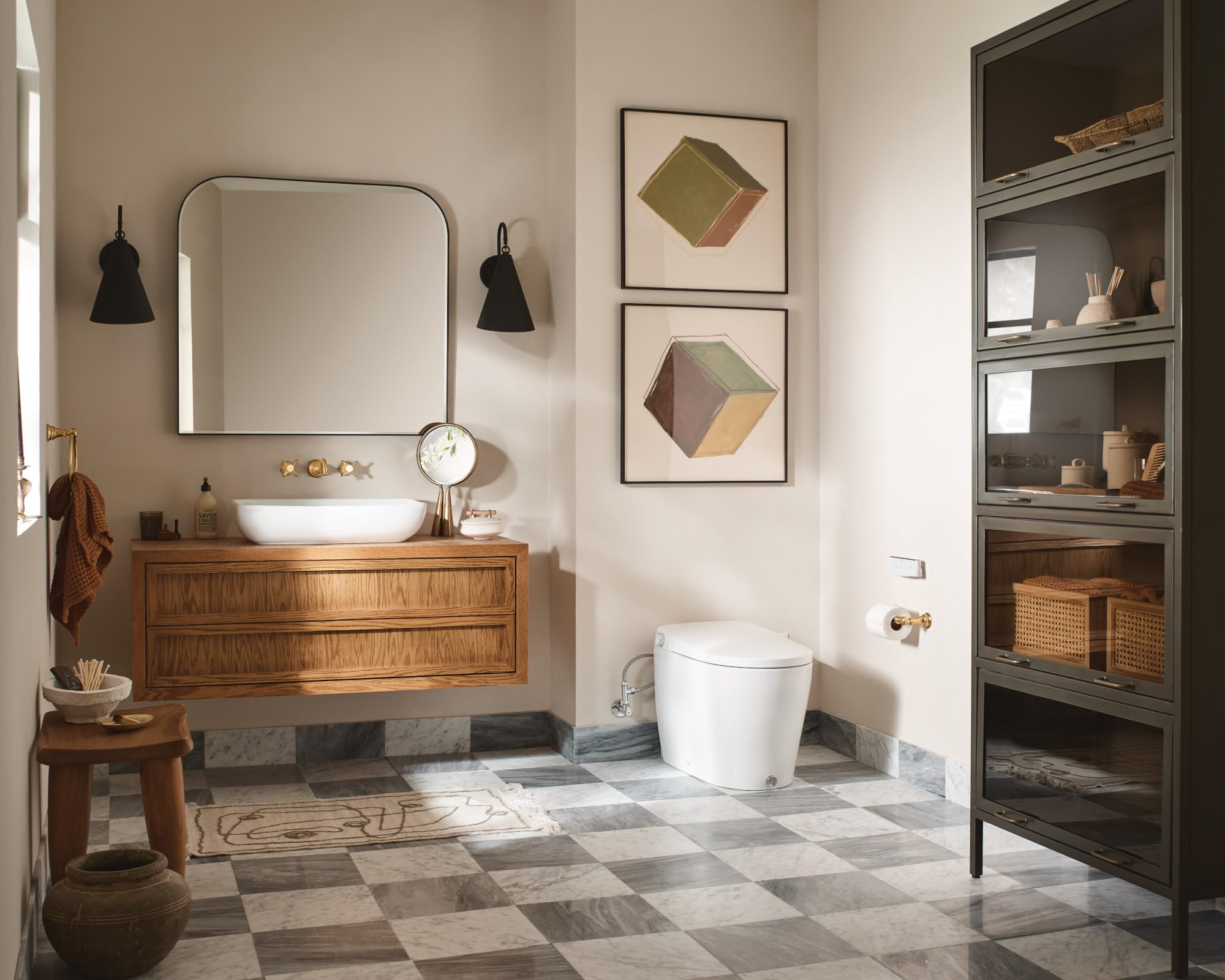 White elongated bidet toilet with integrated tank and control panel, positioned in modern bathroom setting.