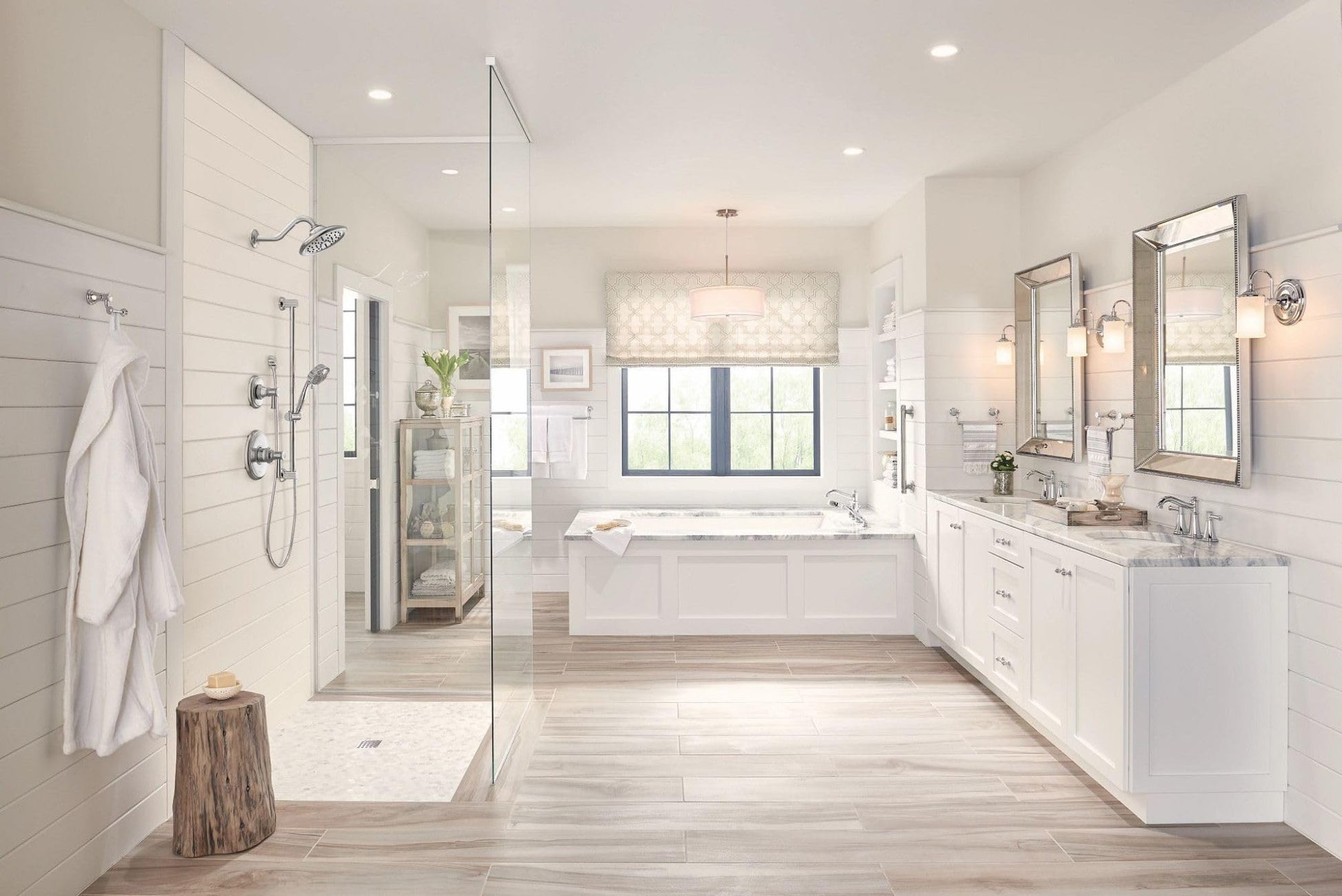 Chrome single-handle valve trim kit mounted on white bathroom wall above sink counter.