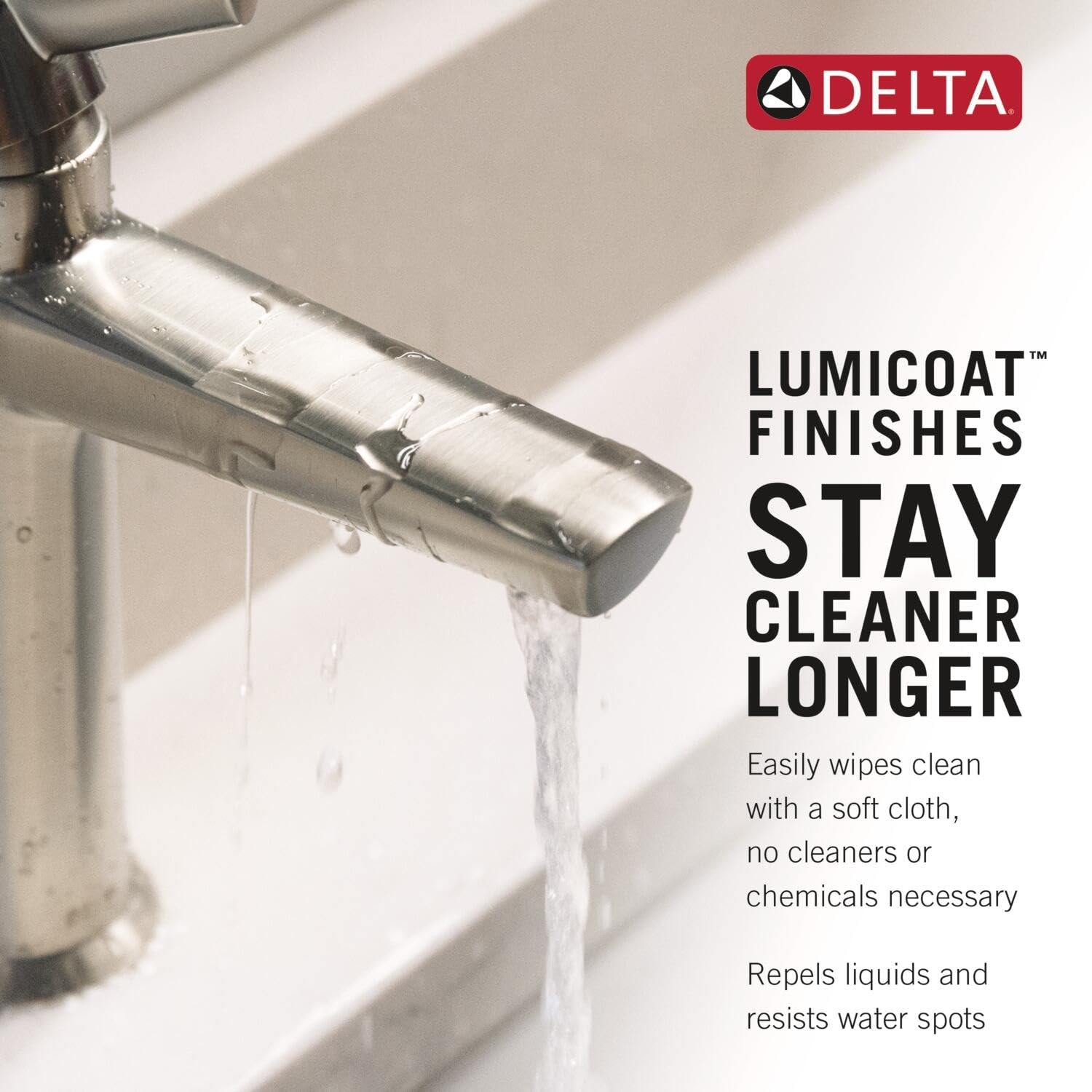 Champagne bronze single-handle bathroom faucet with water running from the spout over a sink.