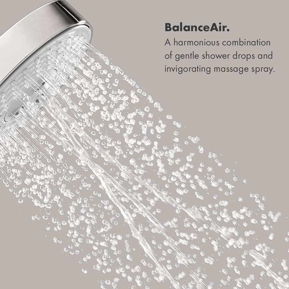 Brushed nickel round shower head with multiple water jets spraying downward.