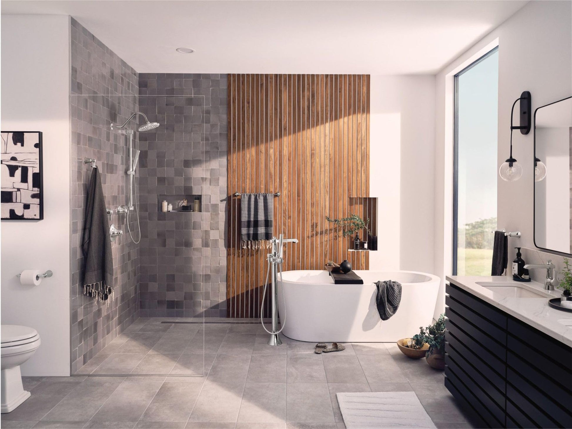 Chrome thermostatic shower valve trim kit with round showerhead and hand shower mounted on gray tile shower wall.