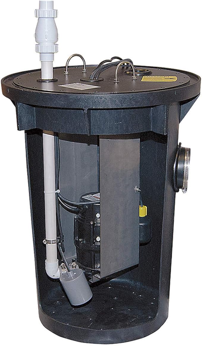 Black cylindrical basin system with white discharge pipe, multiple handles, internal grinder pump, and yellow alarm indicator