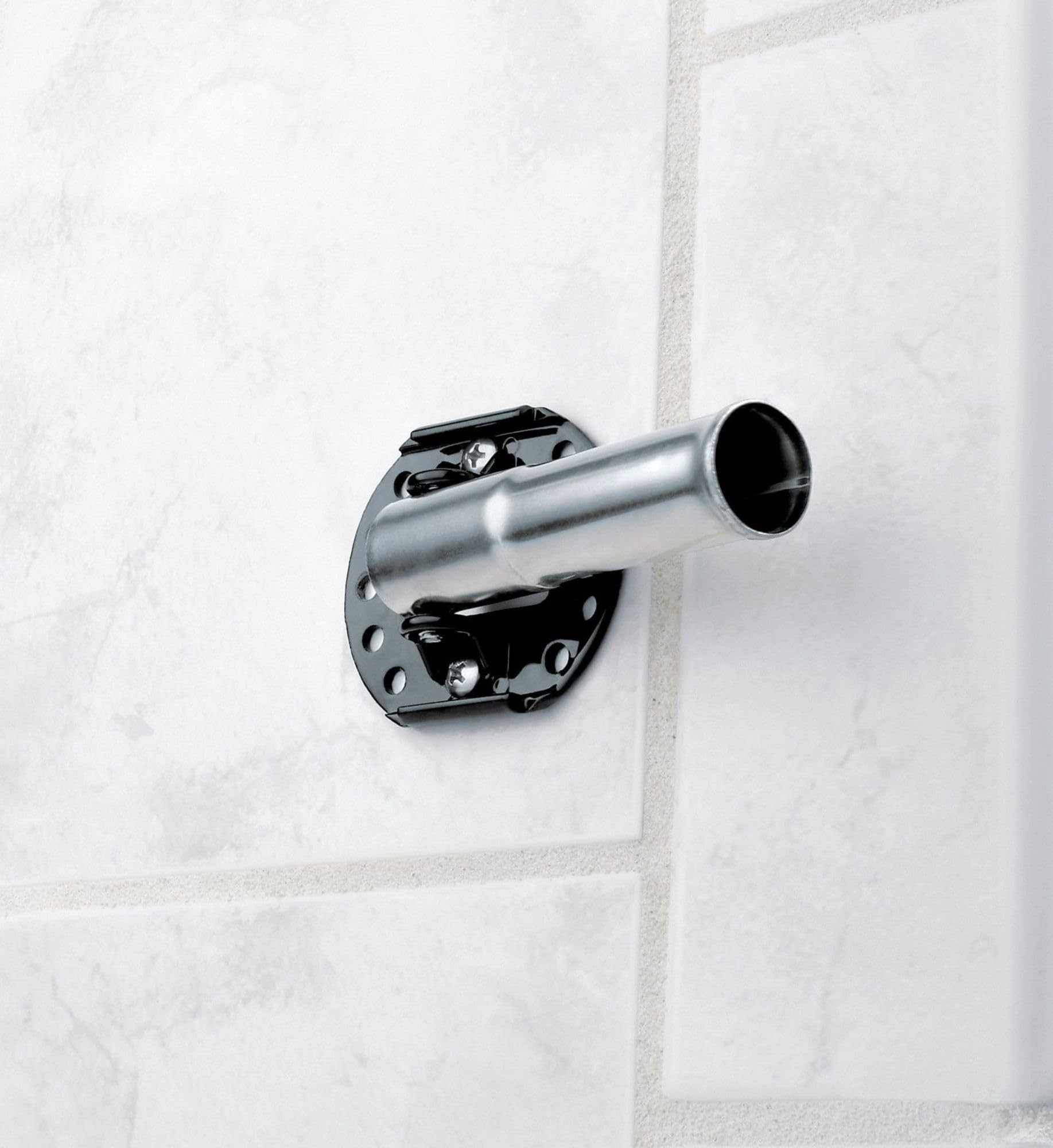 Brushed nickel curved shower rod with black mounting bracket installed on white tile wall.