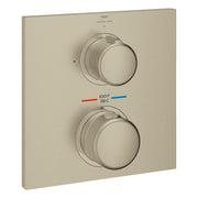 Brushed nickel thermostatic valve trim with two round handles, temperature indicator, and Grohe Spa branding on square plate.