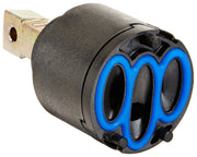 Delta Trinsic valve cartridge with gray body, blue diamond-shaped handle, and brass mounting bracket.
