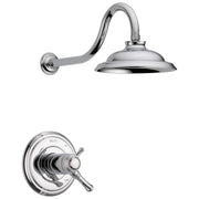 Chrome shower trim with curved wall arm, round showerhead, and valve control with lever handle.