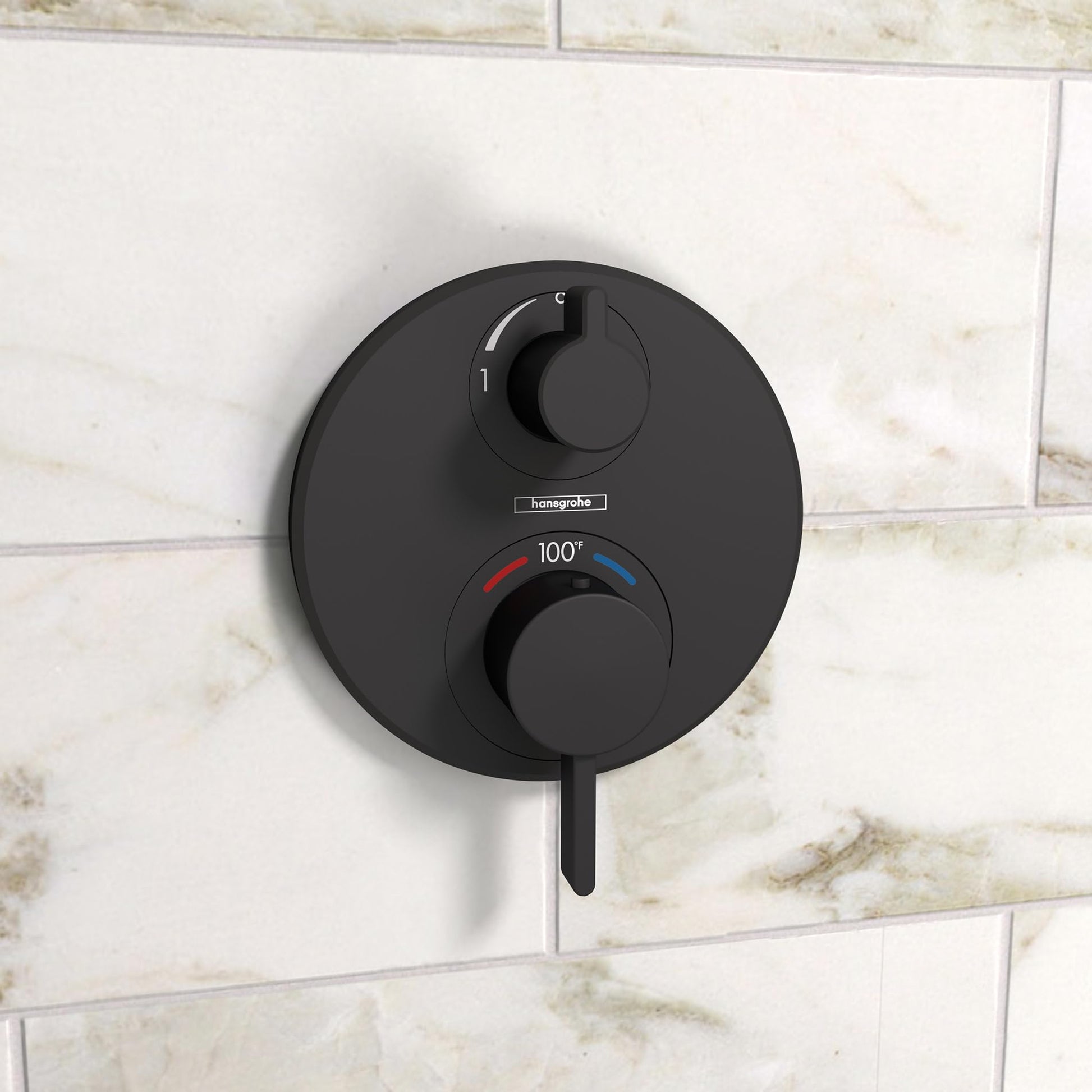 Matte black circular thermostatic trim with upper volume control knob, lower diverter knob marked 100°, and temperature indic