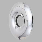 Chrome circular escutcheon with central opening, temperature and off markings, and mounting holes visible on surface.