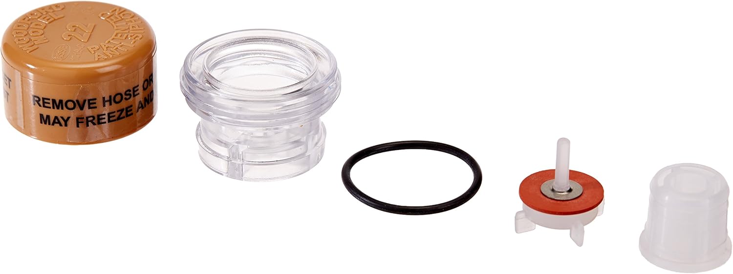 Vacuum breaker float kit components including brass cap, clear chamber, black O-ring, red float valve, and clear plastic cove