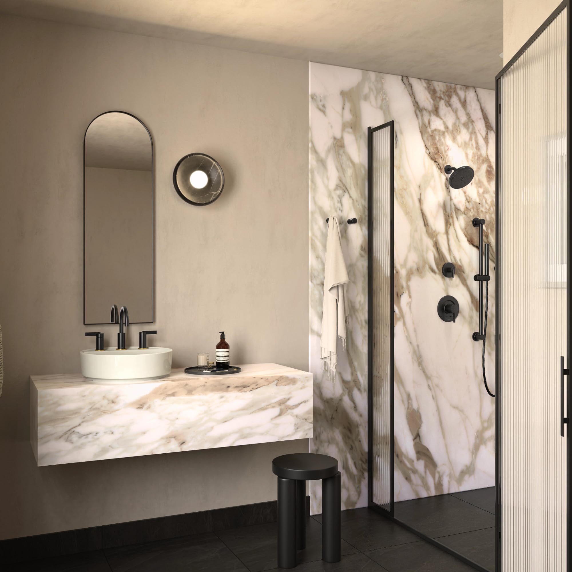Matte black rain shower head and handle mounted on marble-tiled shower wall with single control valve.