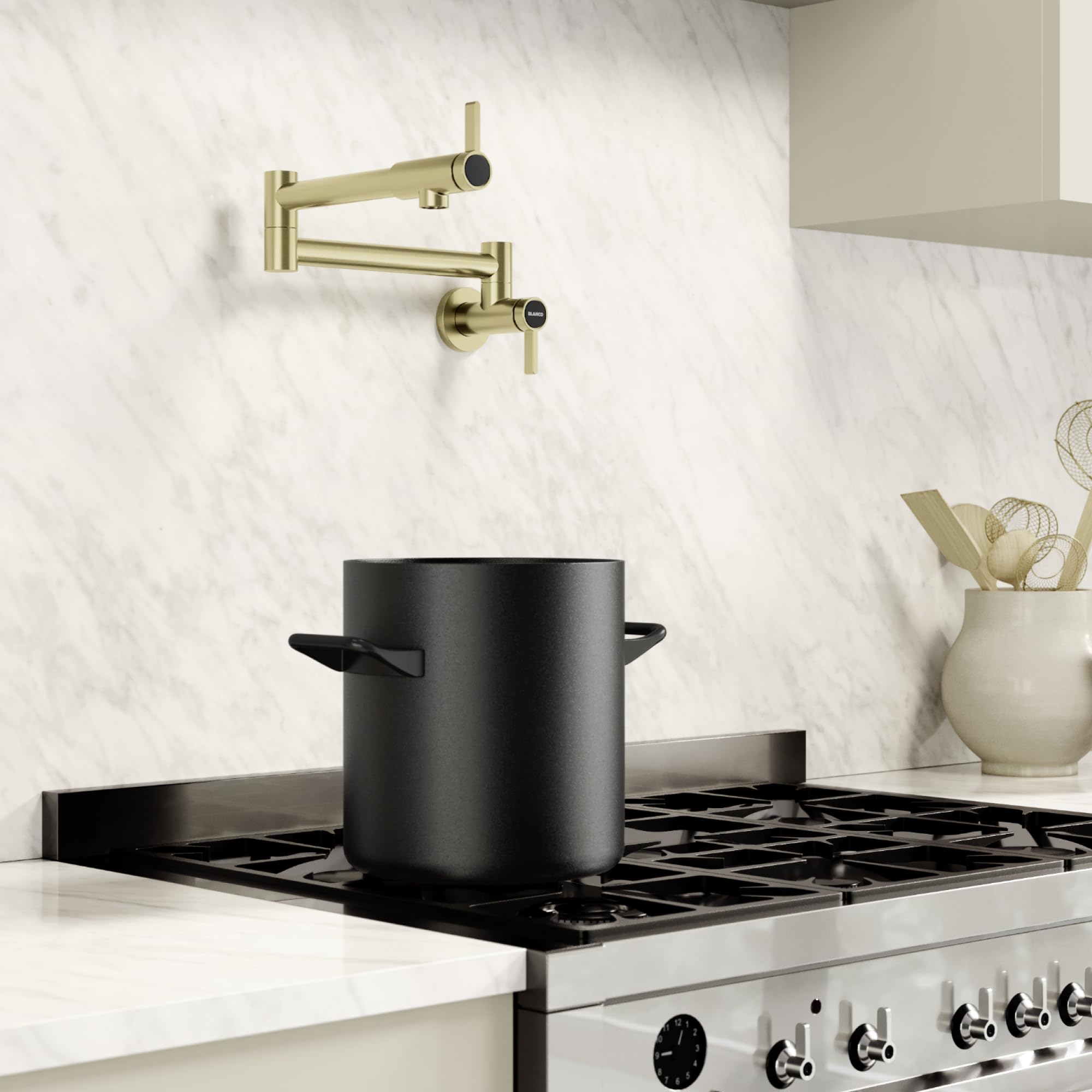 Satin gold wall-mounted potfiller faucet with articulating arm and lever handle above stovetop.
