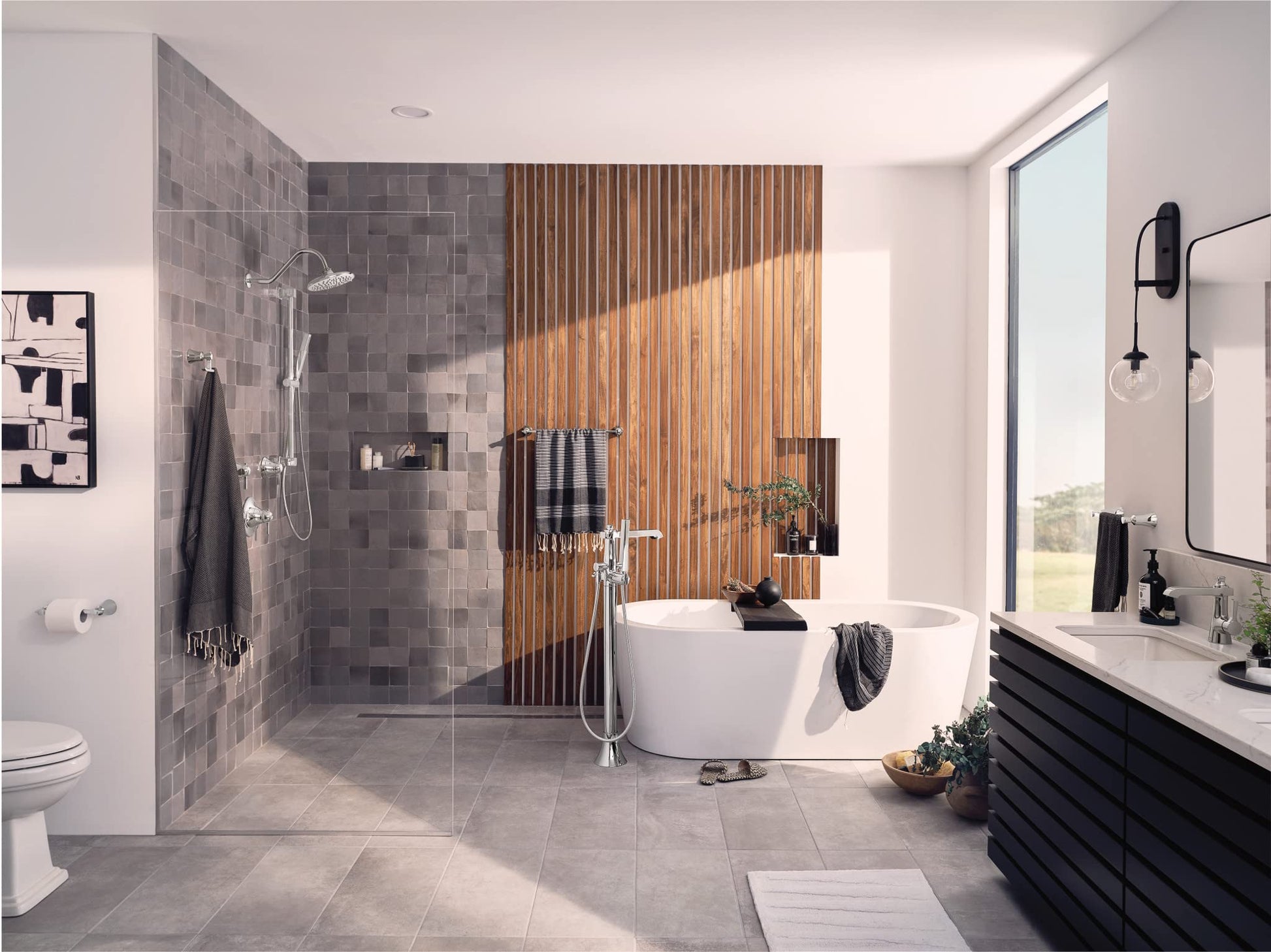 Chrome handheld showerhead with slide bar mounted on tiled shower wall in modern bathroom.