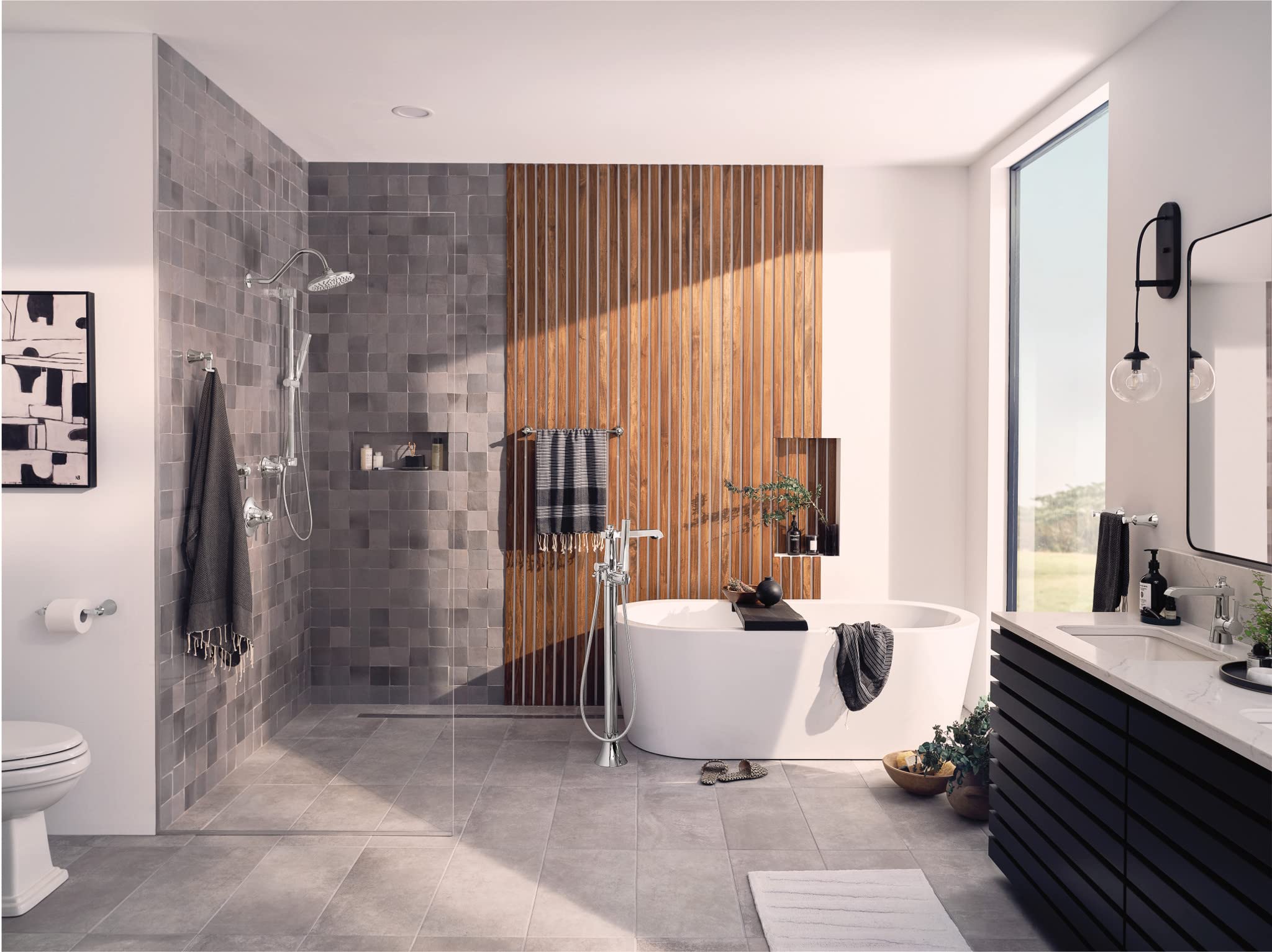 Chrome handheld showerhead with slide bar mounted on tiled shower wall in modern bathroom.