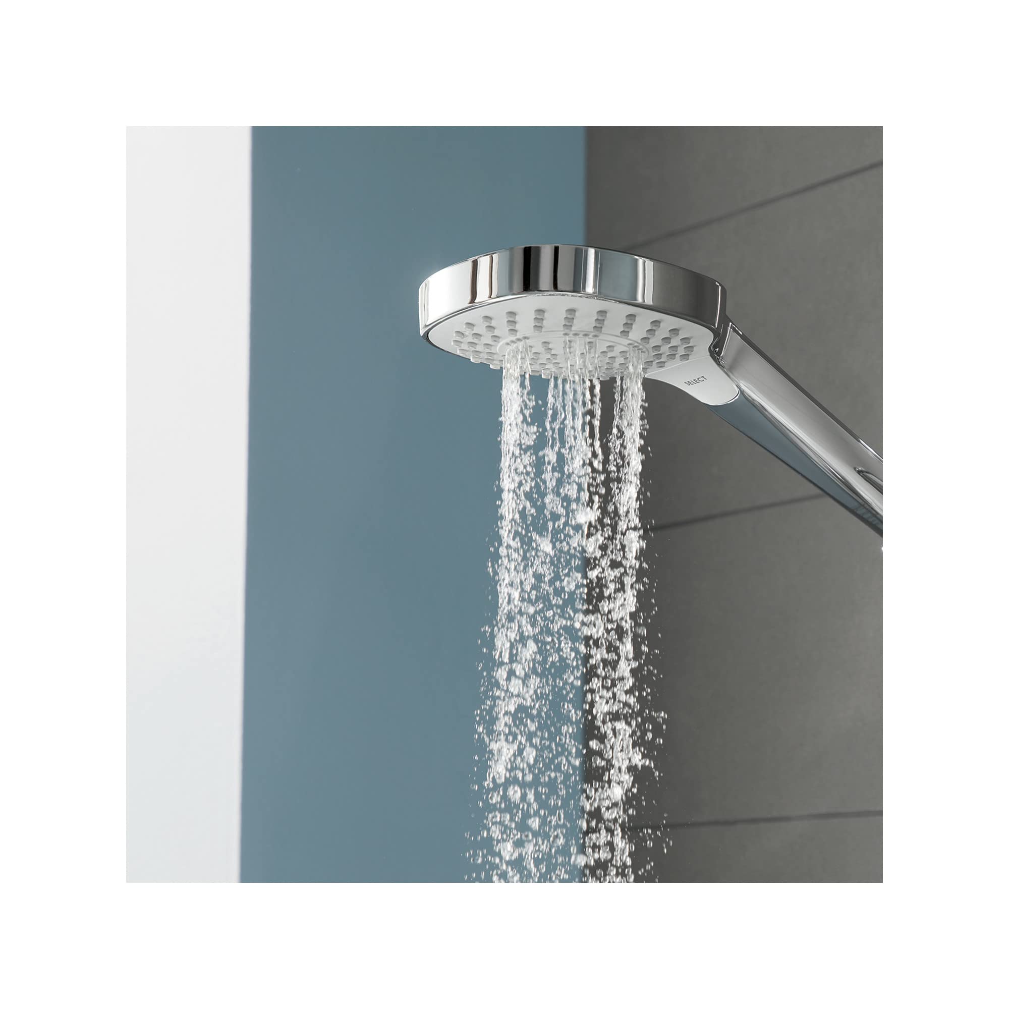 Chrome and white handheld showerhead with circular face and multiple water jets in active use.