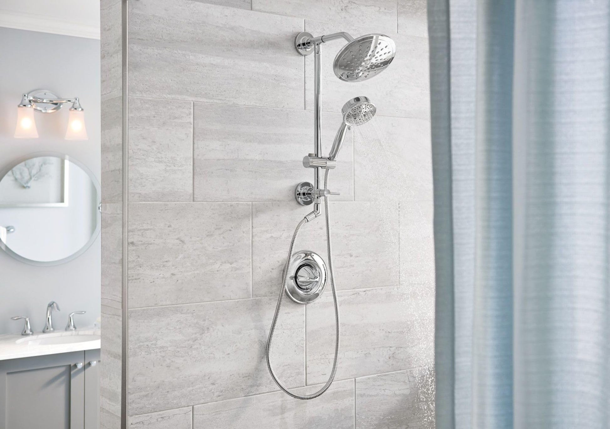 Chrome shower system with fixed overhead showerhead, handheld showerhead on vertical slidebar, and control valve mounted on t