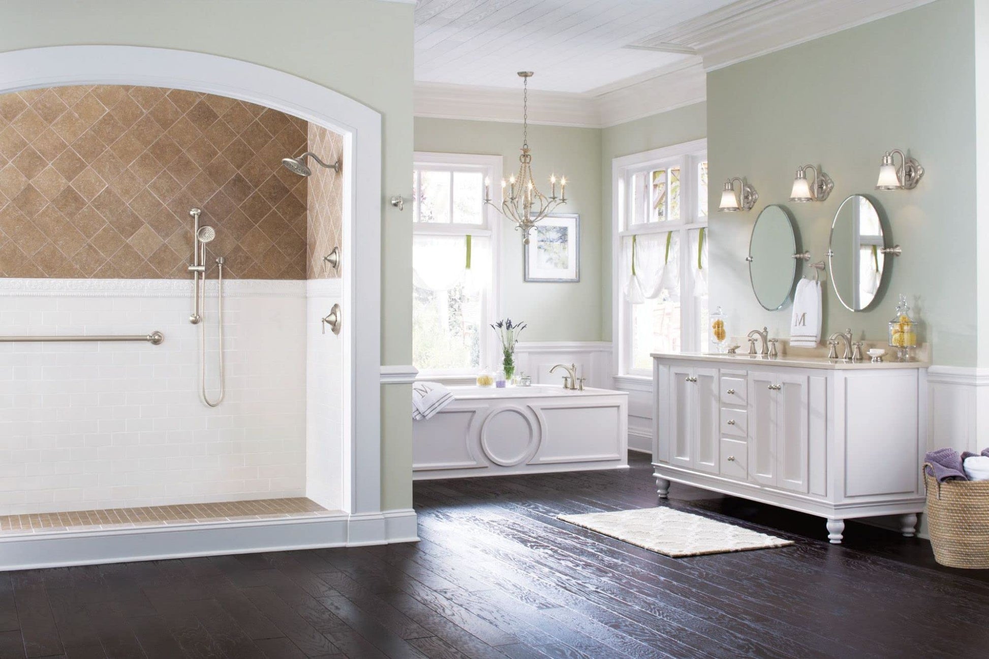 Brushed nickel round rainfall showerhead mounted on tile shower wall with hand spray attachment visible.
