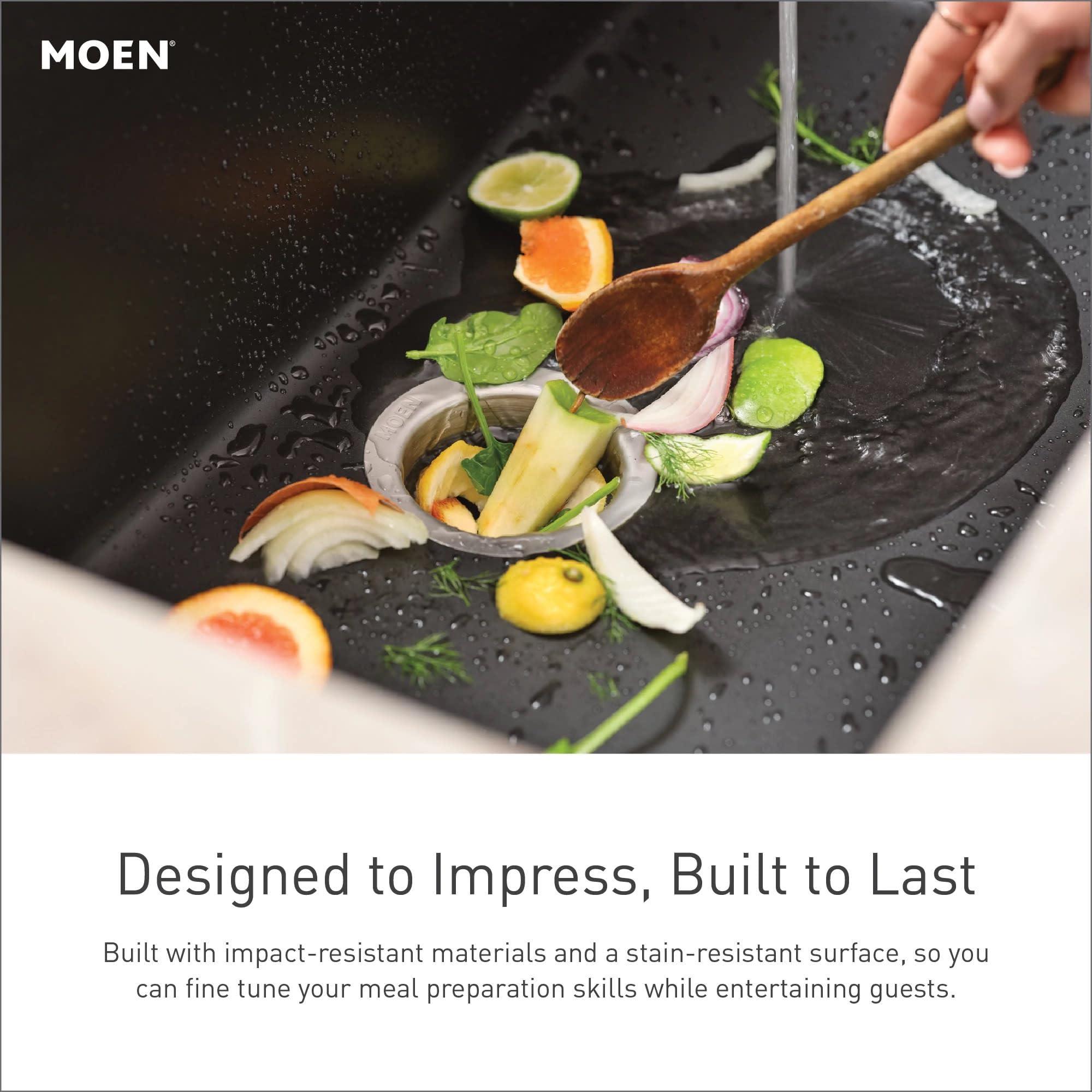 White granite undermount kitchen sink with single bowl, vegetables and wooden spoon visible during food preparation.