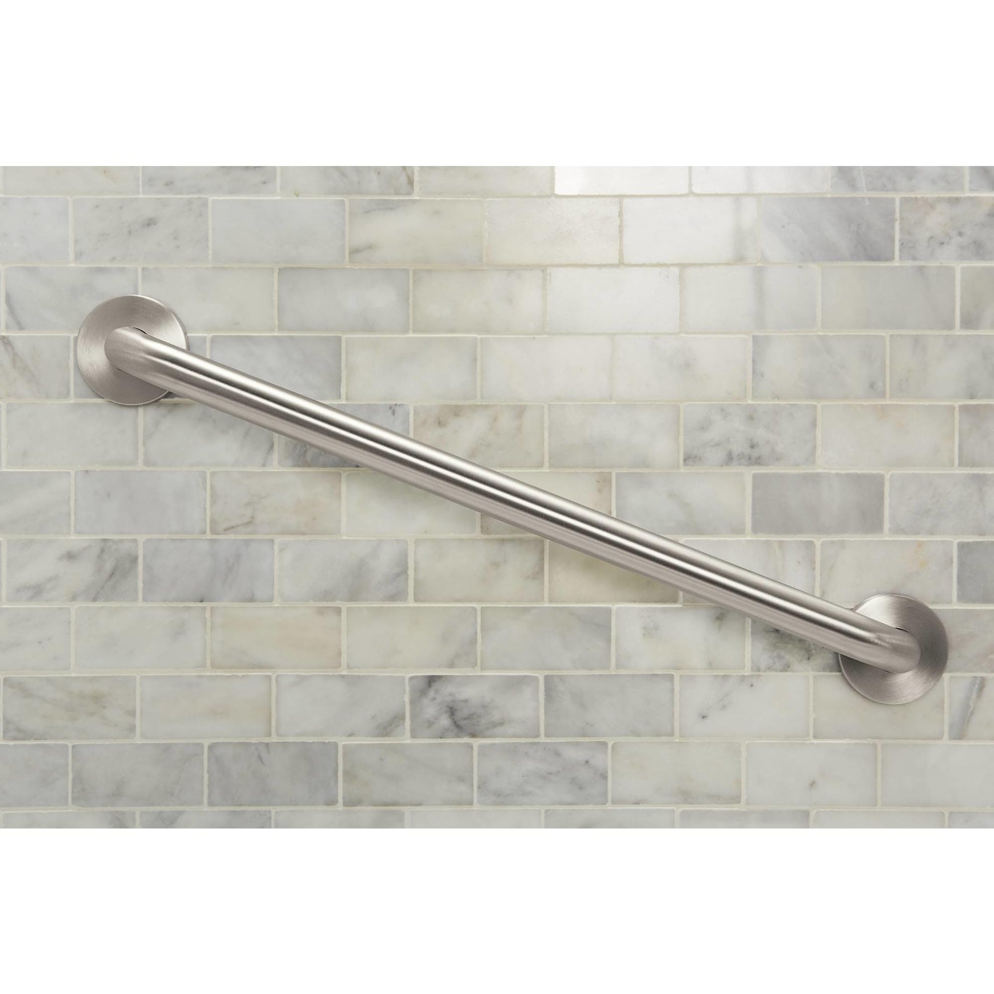 Brushed nickel cylindrical grab bar mounted horizontally on marble subway tile wall.