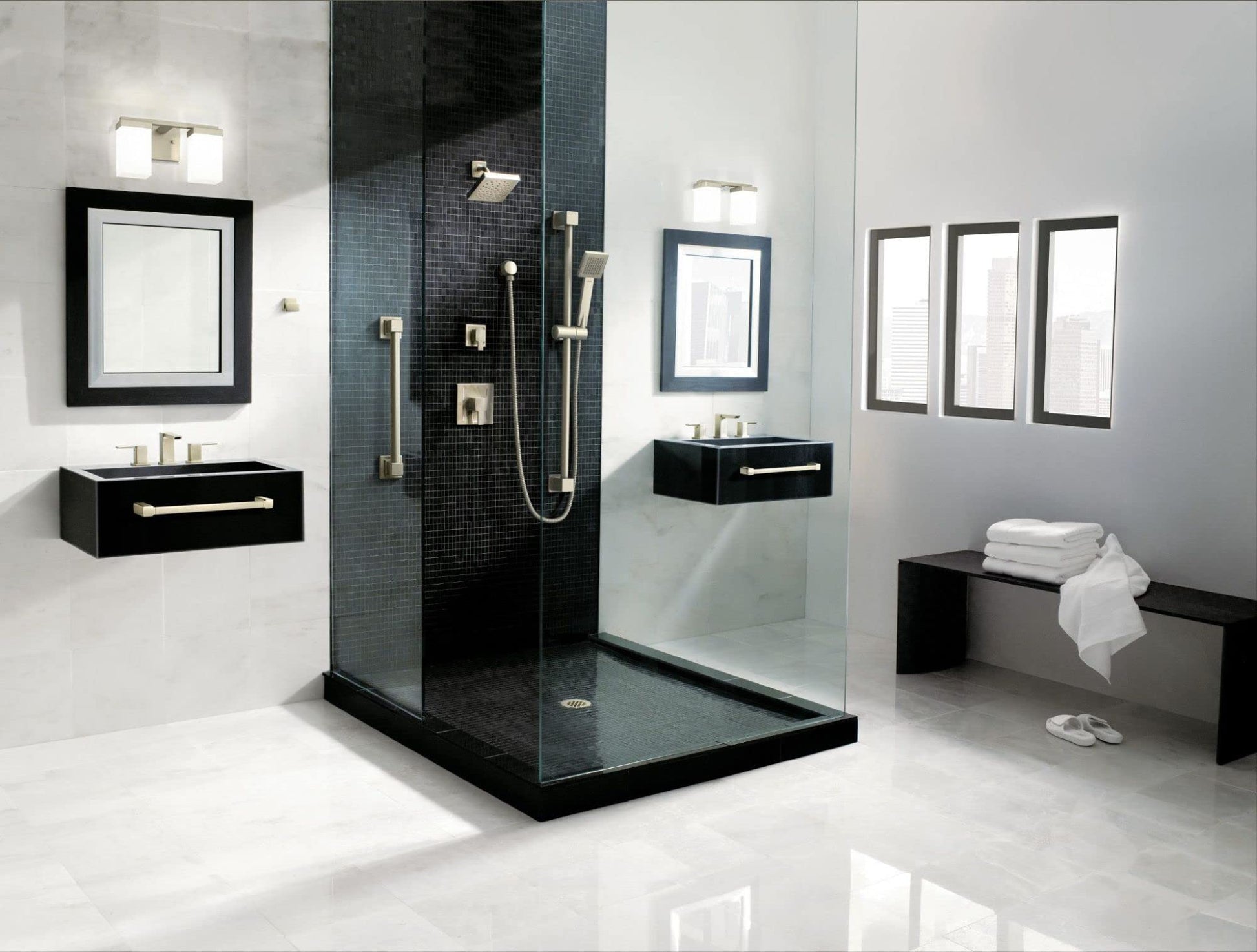 Brushed nickel shower trim kit with angled showerhead, handheld spray, and control valve mounted on black tile shower wall.