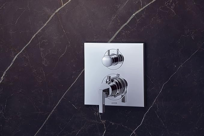 Chrome thermostatic shower trim with upper volume control knob and lower diverter lever on square plate.