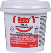 White plastic container of Oatey No. 5 lead-free solder paste flux with red label and white screw-on lid.