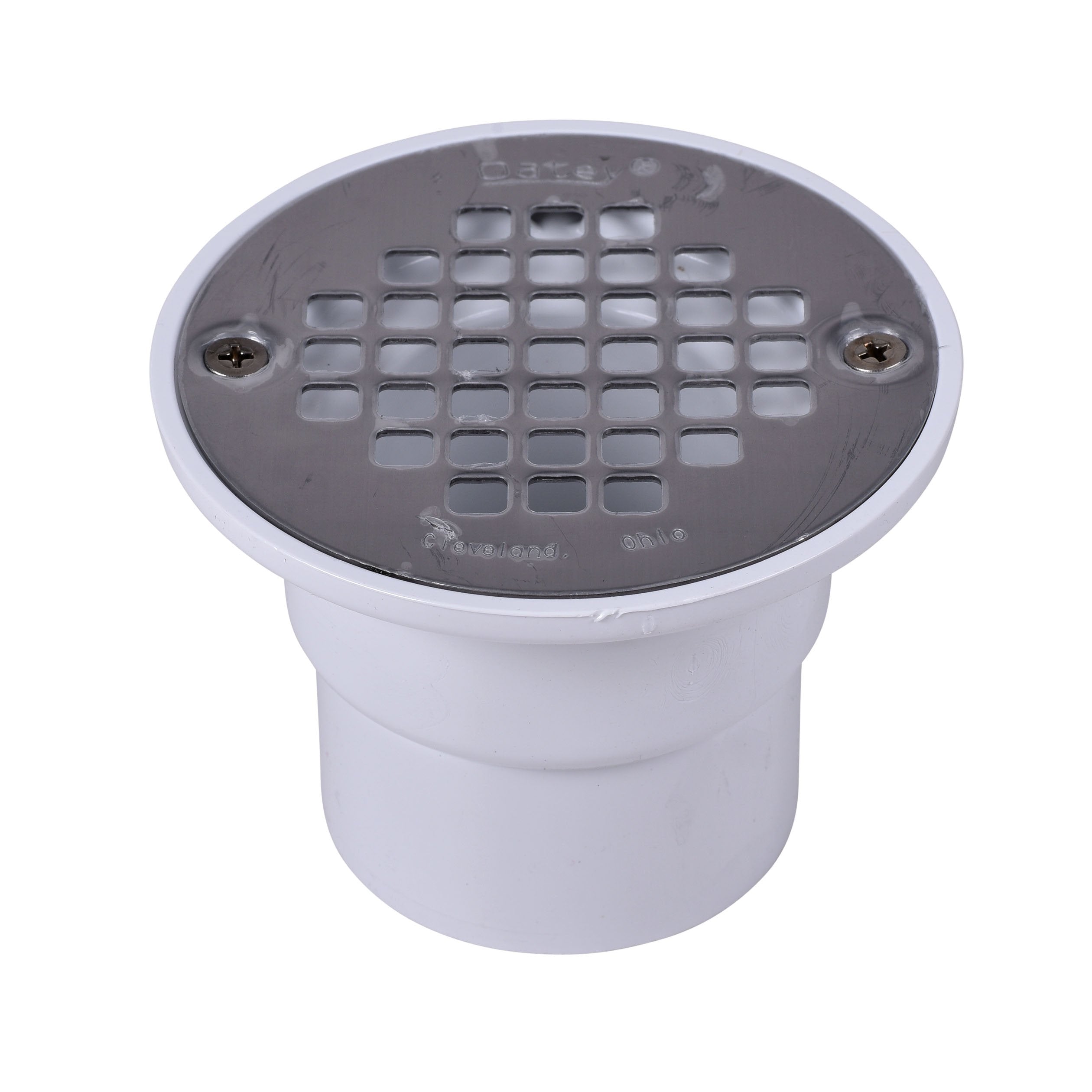 Black round shower drain strainer with grid pattern mounted on white PVC pipe fitting.