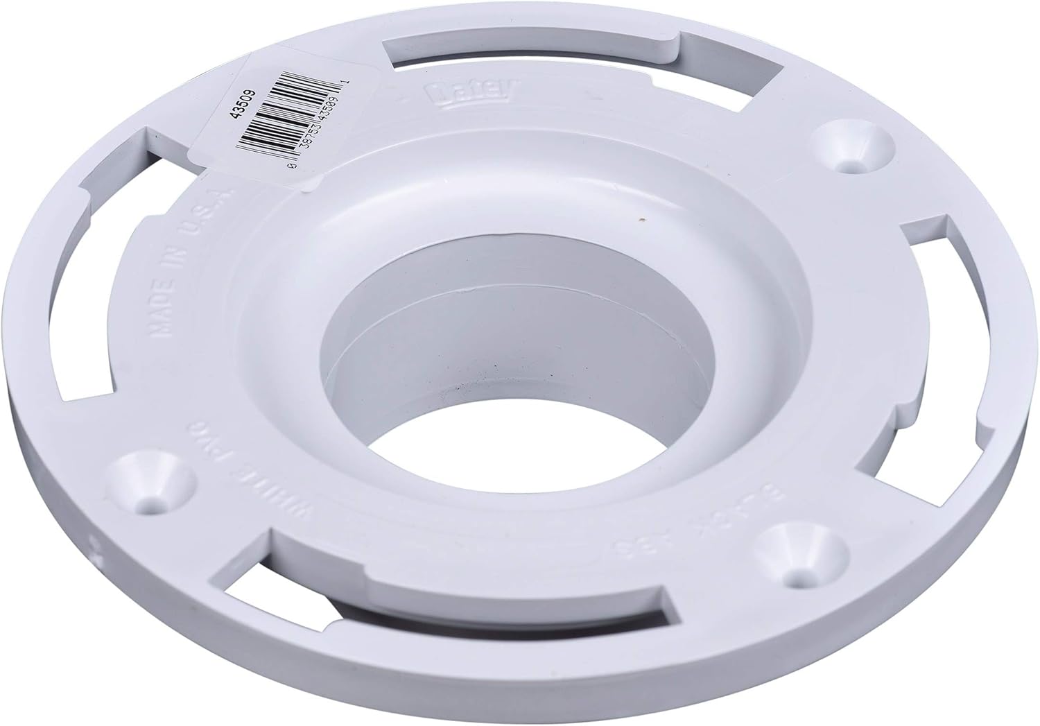 White PVC closet flange with plastic ring, central opening, four mounting holes, and barcode label.